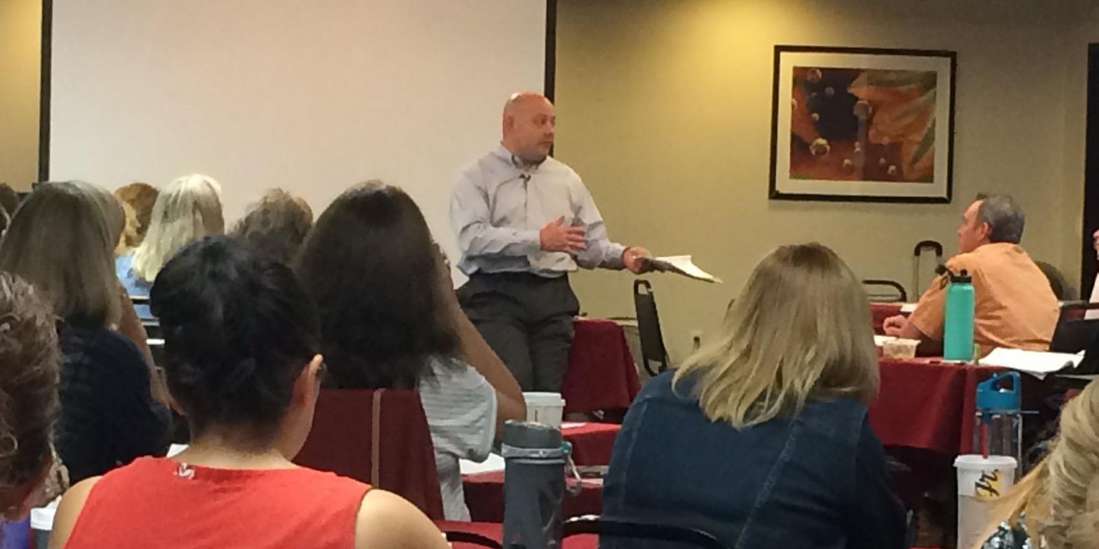 Kevin Macho speaking to a full room of seminar attendees